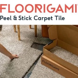 person installing carpet tiles Carneys Carpet Gallery in Jeffersontown, KY